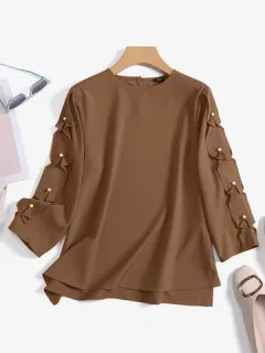 Blusa de manga 3/4 con detalle de perlas