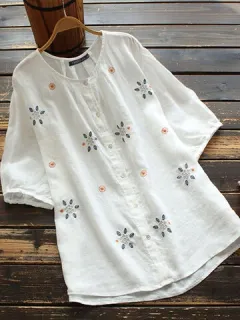 Blusa suelta con botones bordados florales