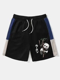 Shorts de patchwork con bloques de colores y estampado de pandas